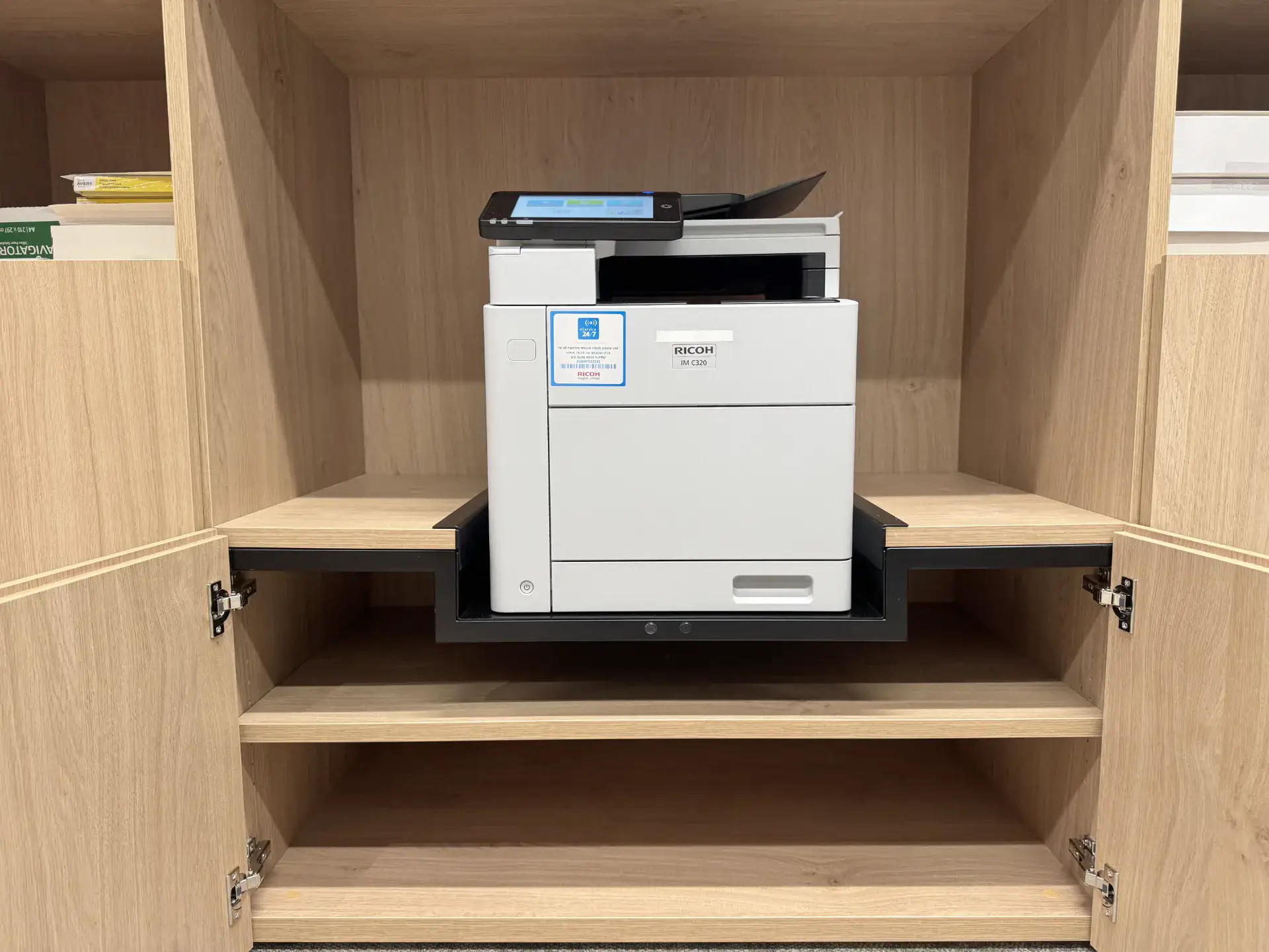 An existing office cabinet adapted by REFRAME with a new fitment for a printer, reworked rather than replaced