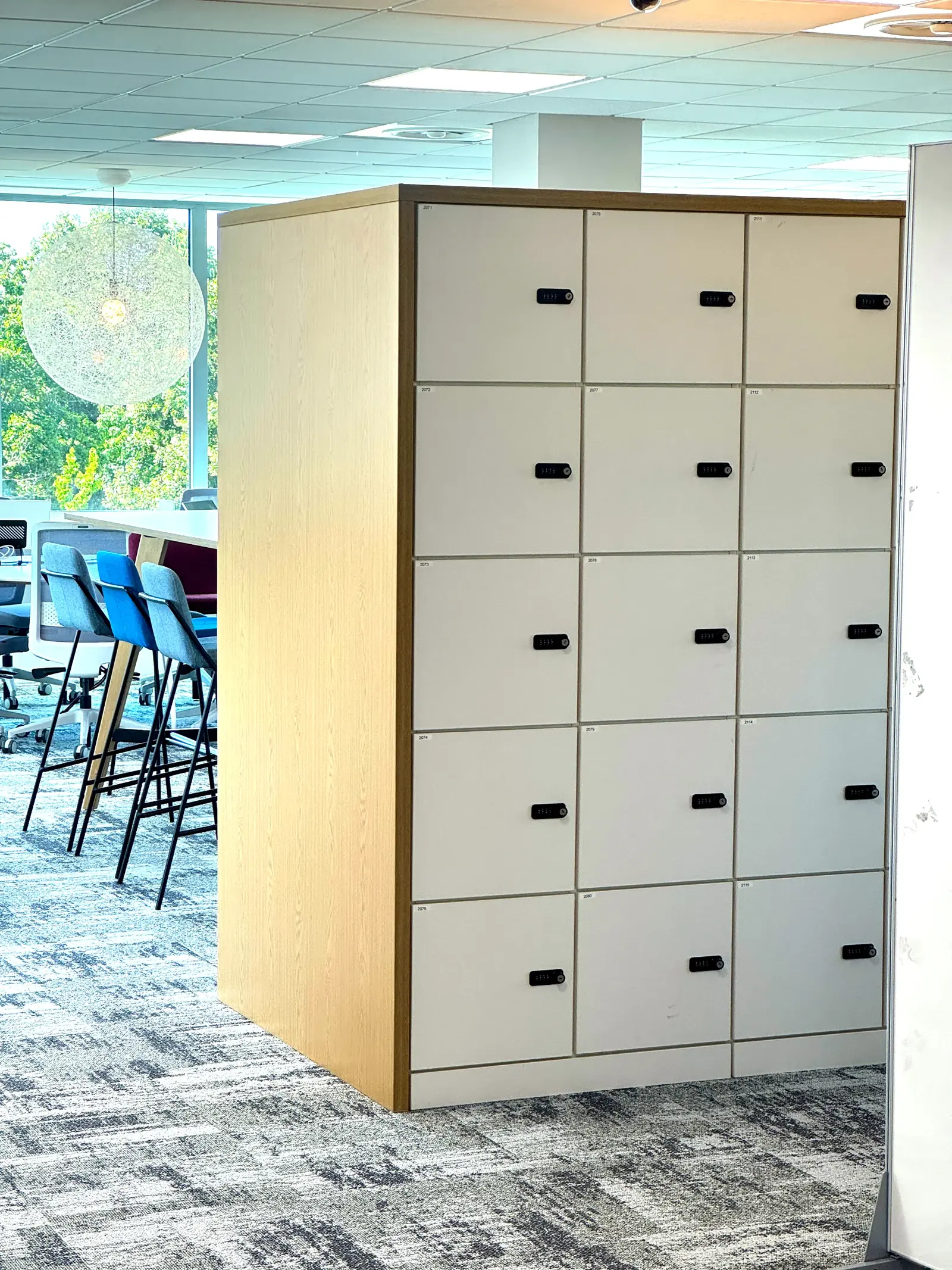 Custom locker shroud kit fitted over existing units during an office refurbishment