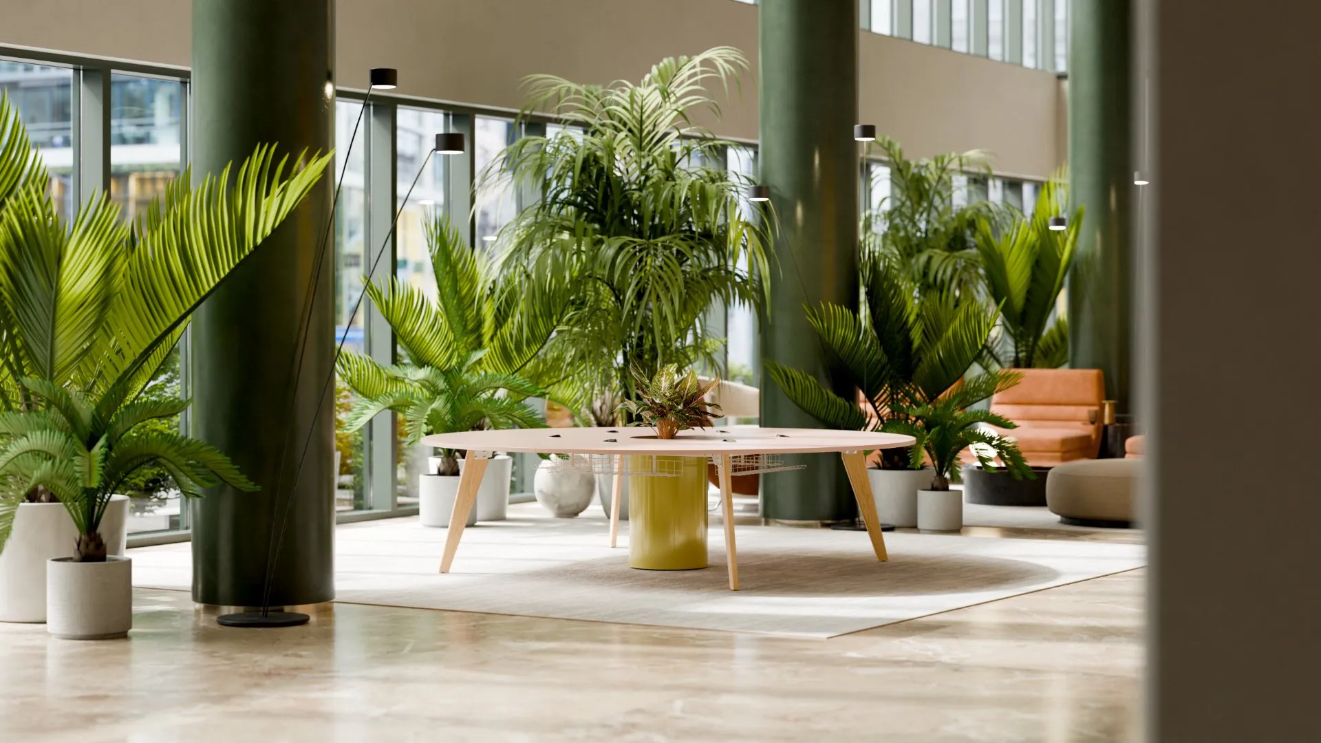 Orbital table with natural oak legs and yellow planter in a co-working breakout space